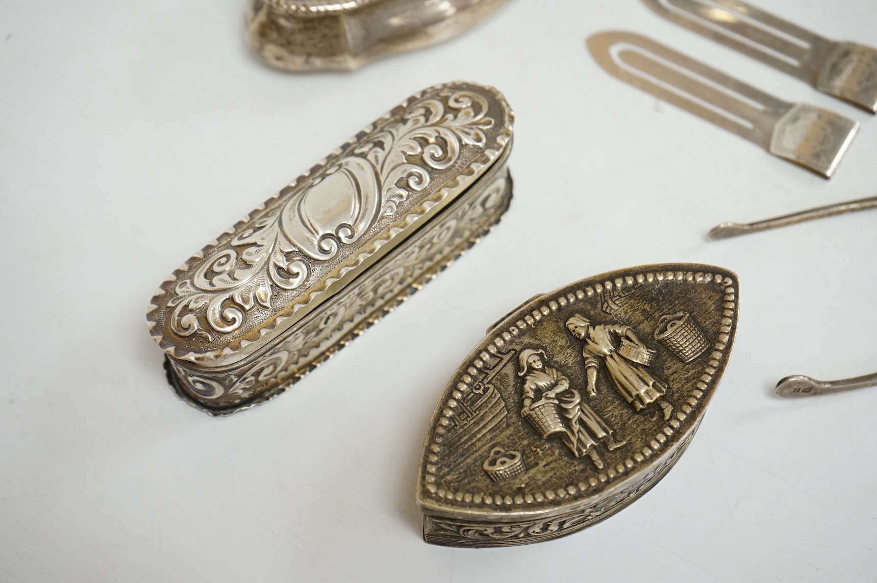 Three late 19th/early 20th century repousse silver trinket boxes, including one with Reynold's Angels decoration, Birmingham, 1899, 91mm, a larger 19th century Dutch white metal oval box and cover, a pair of wishbone sil